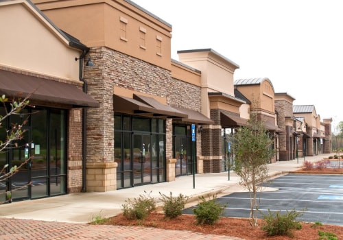 What is the difference between a neighborhood shopping center and a community shopping center?